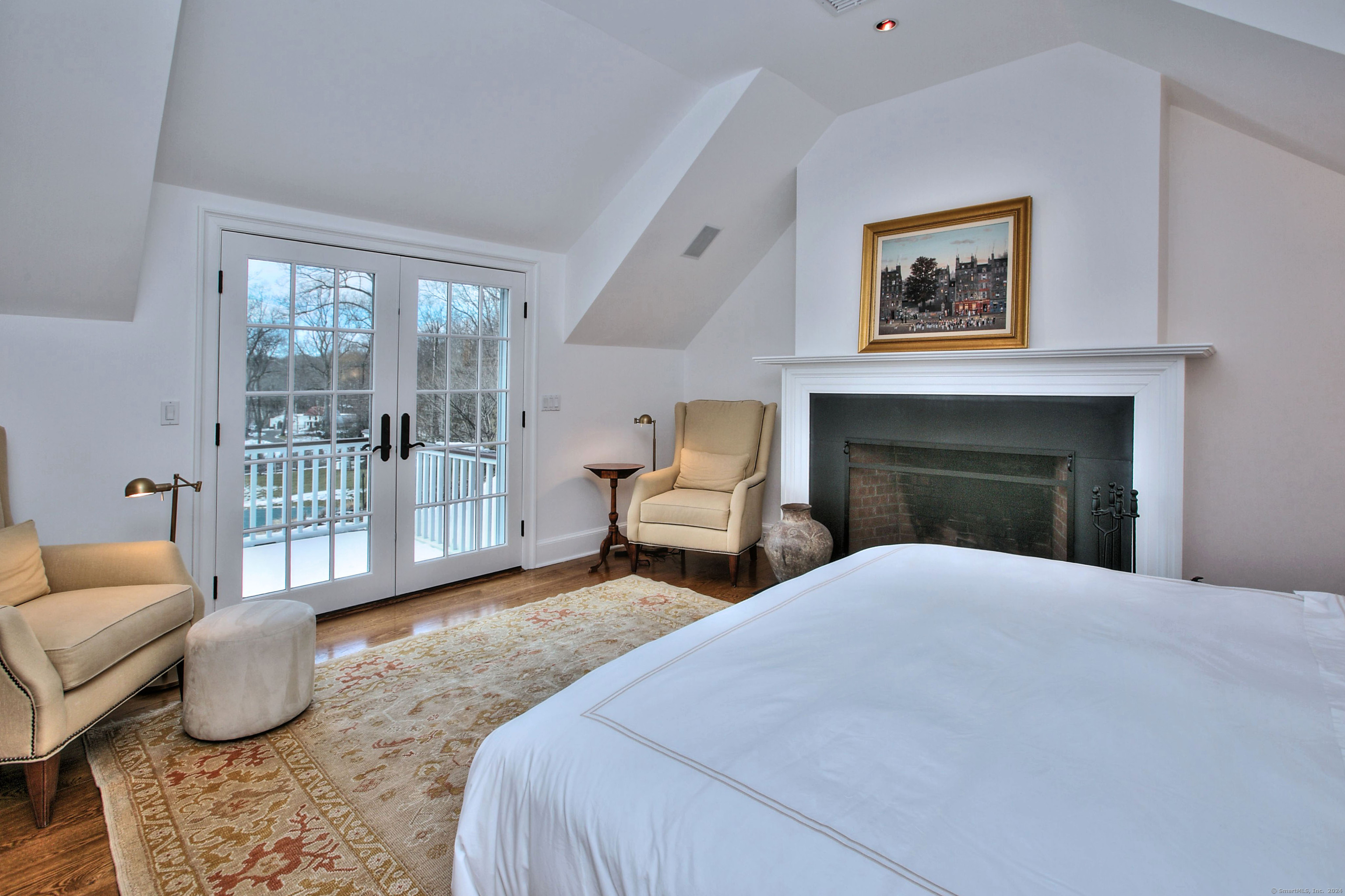 15 Catamount Road Westport, CT 06880 - Photo 20 of 39 a bedroom with a bed a couch and a window