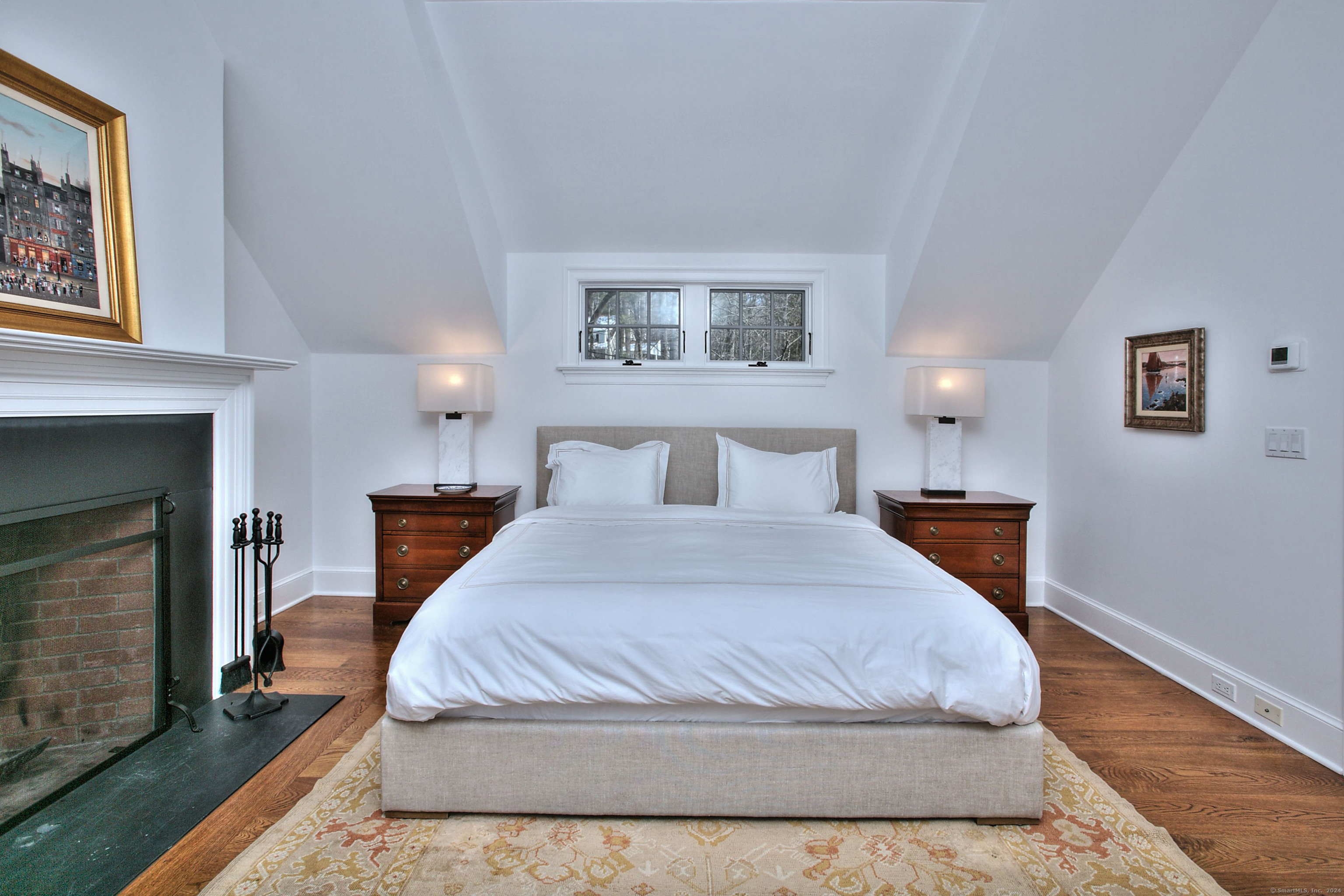 15 Catamount Road Westport, CT 06880 - Photo 21 of 39 a bedroom with a bed and a fireplace