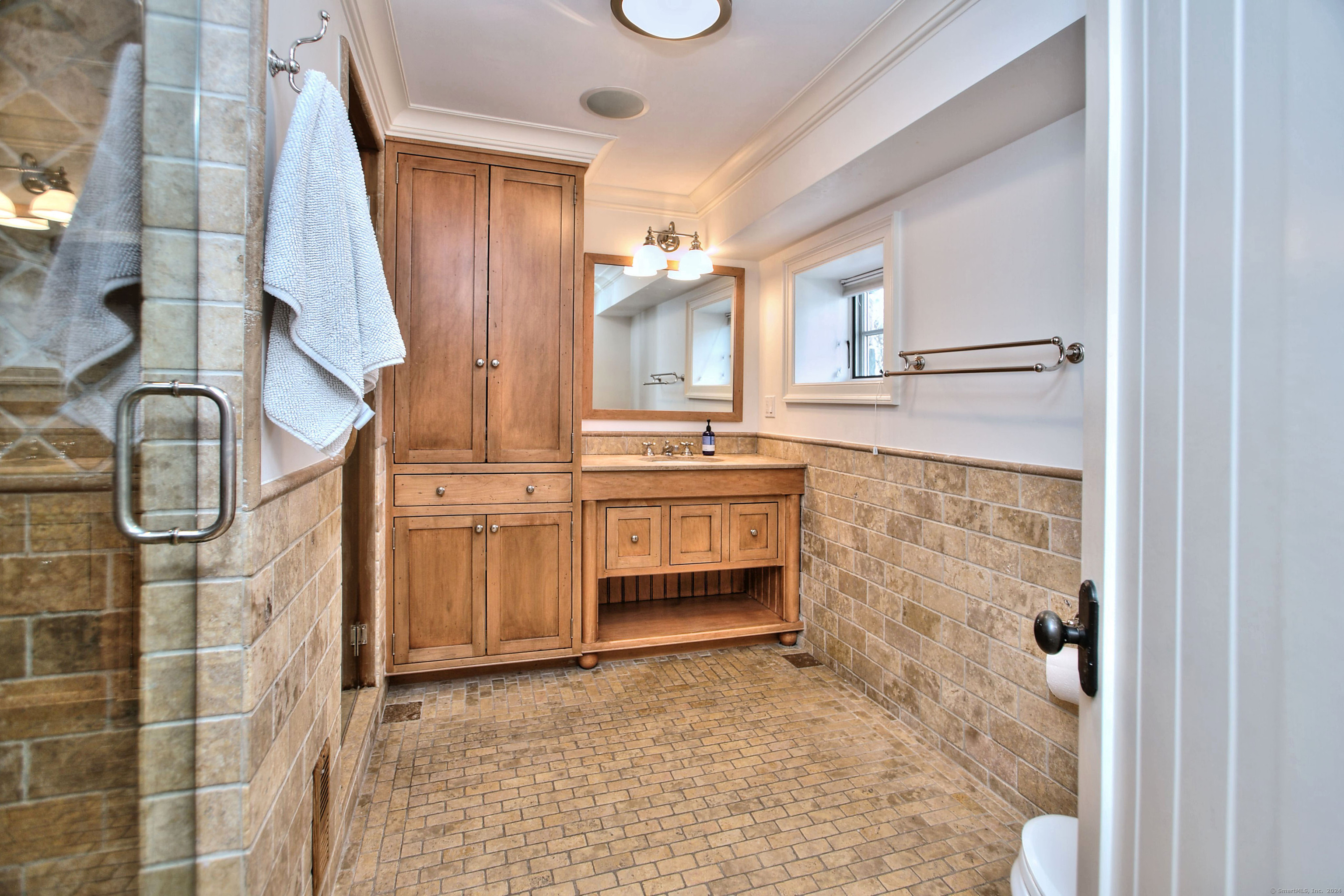 15 Catamount Road Westport, CT 06880 - Photo 31 of 39 a bathroom with a sink and a mirror