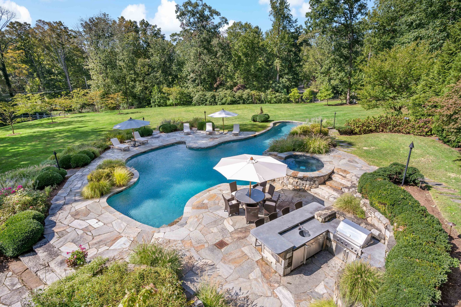 15 Catamount Road Westport, CT 06880 - Photo 35 of 39 a view of a swimming pool and lounge chairs