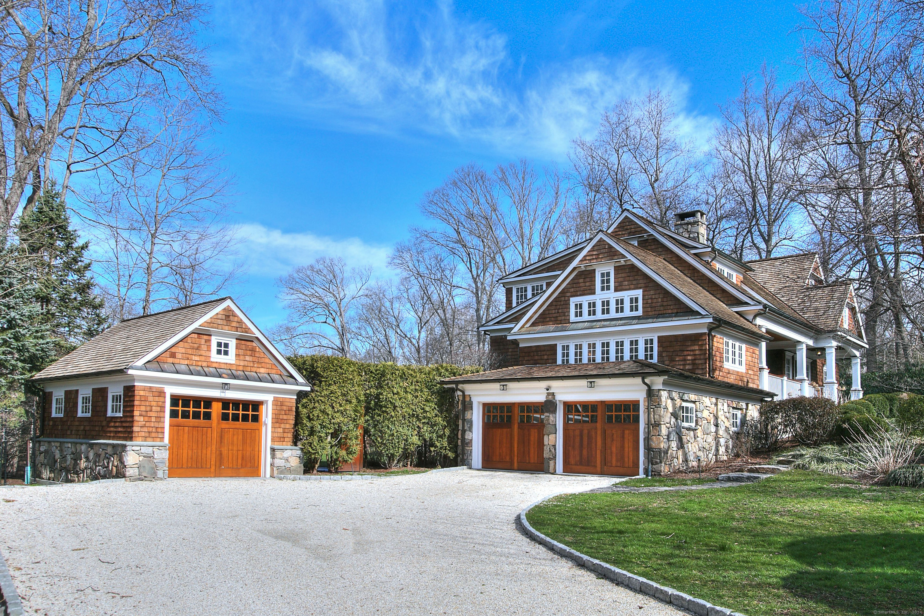 15 Catamount Road Westport, CT 06880 - Photo 5 of 39 a front view of a house with a yard and trees
