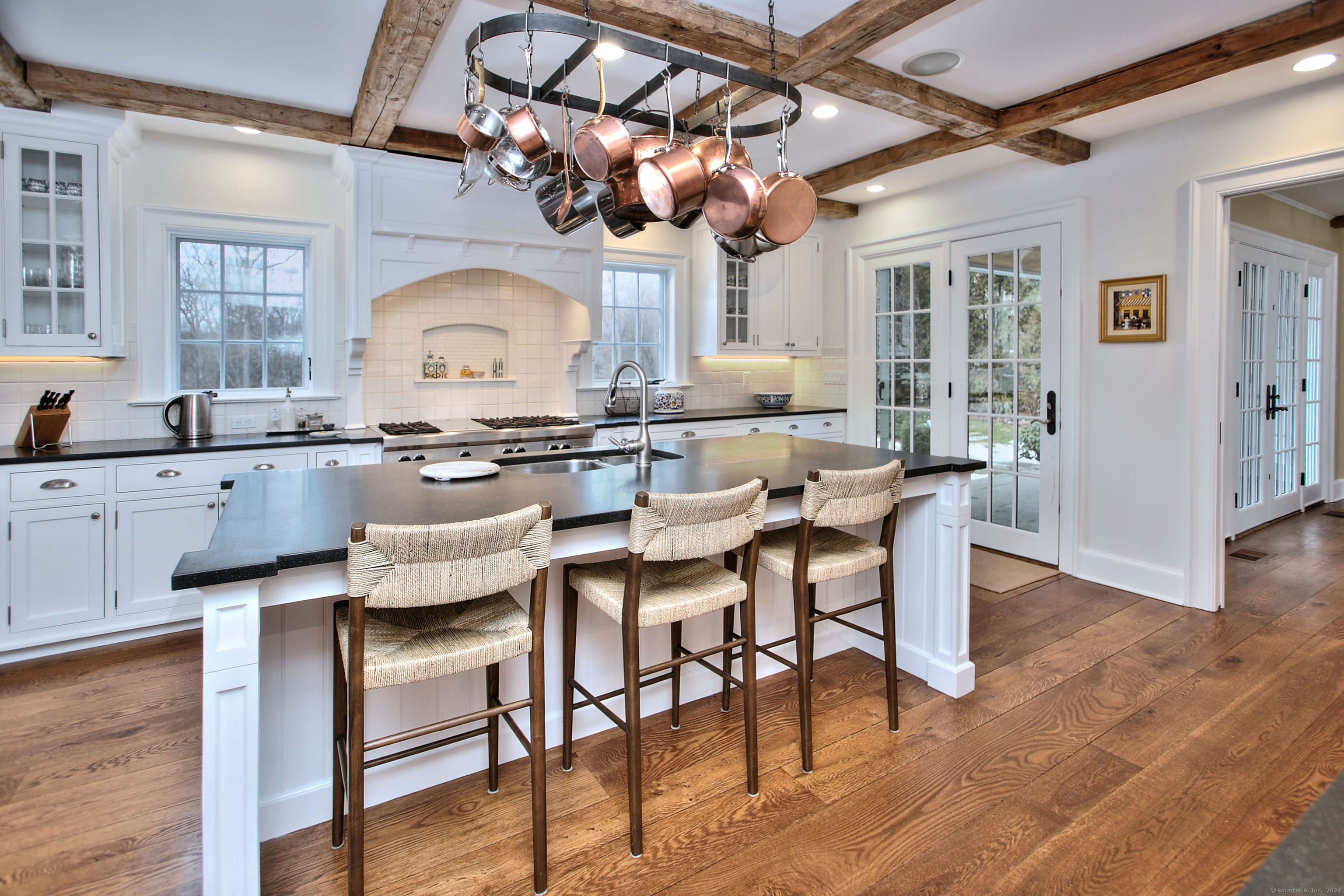 15 Catamount Road Westport, CT 06880 - Photo 9 of 39 a kitchen with a dining table chairs and cabinets
