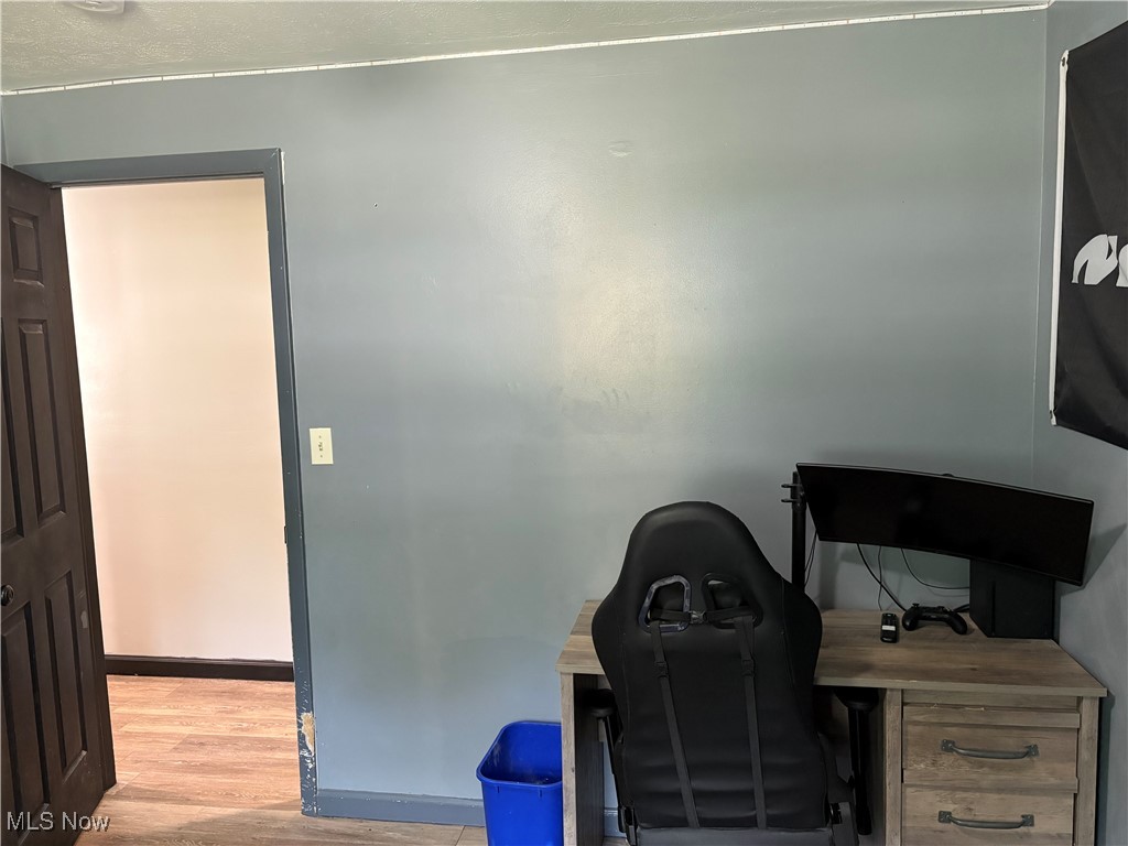 678 High Bridge Road Vermilion, OH 44089 - Photo 7 of 8 Home office with light wood-style floors and baseboards