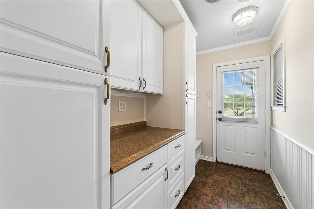 1175 Bloom Street Lucas, TX 75002 - Photo 14 of 36 a kitchen with granite countertop white cabinets and white appliances