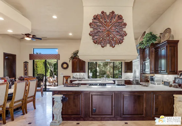 a kitchen with stainless steel appliances granite countertop a stove and a sink