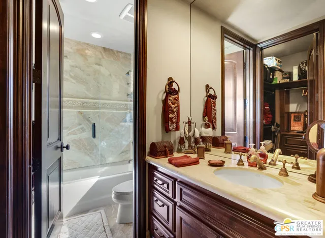 a view of a patio with a table and chairs