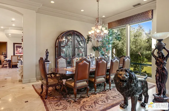 a very nice looking dining room with furniture