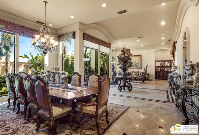 a living room with furniture a fireplace and window