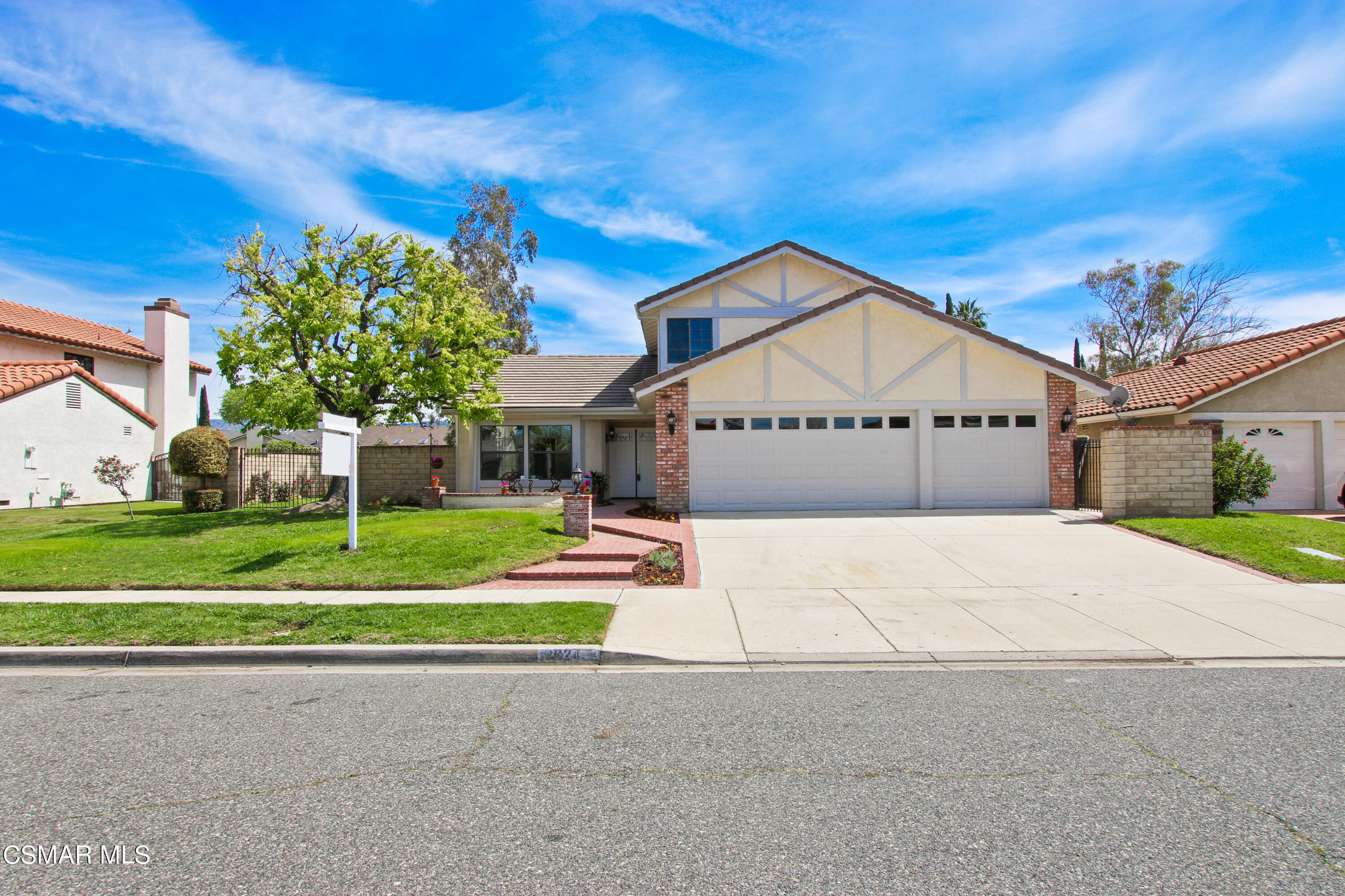 2624 Lemon Drive Simi Valley, CA 93063 - Photo 1 of 22 a front view of a house with a yard and garage
