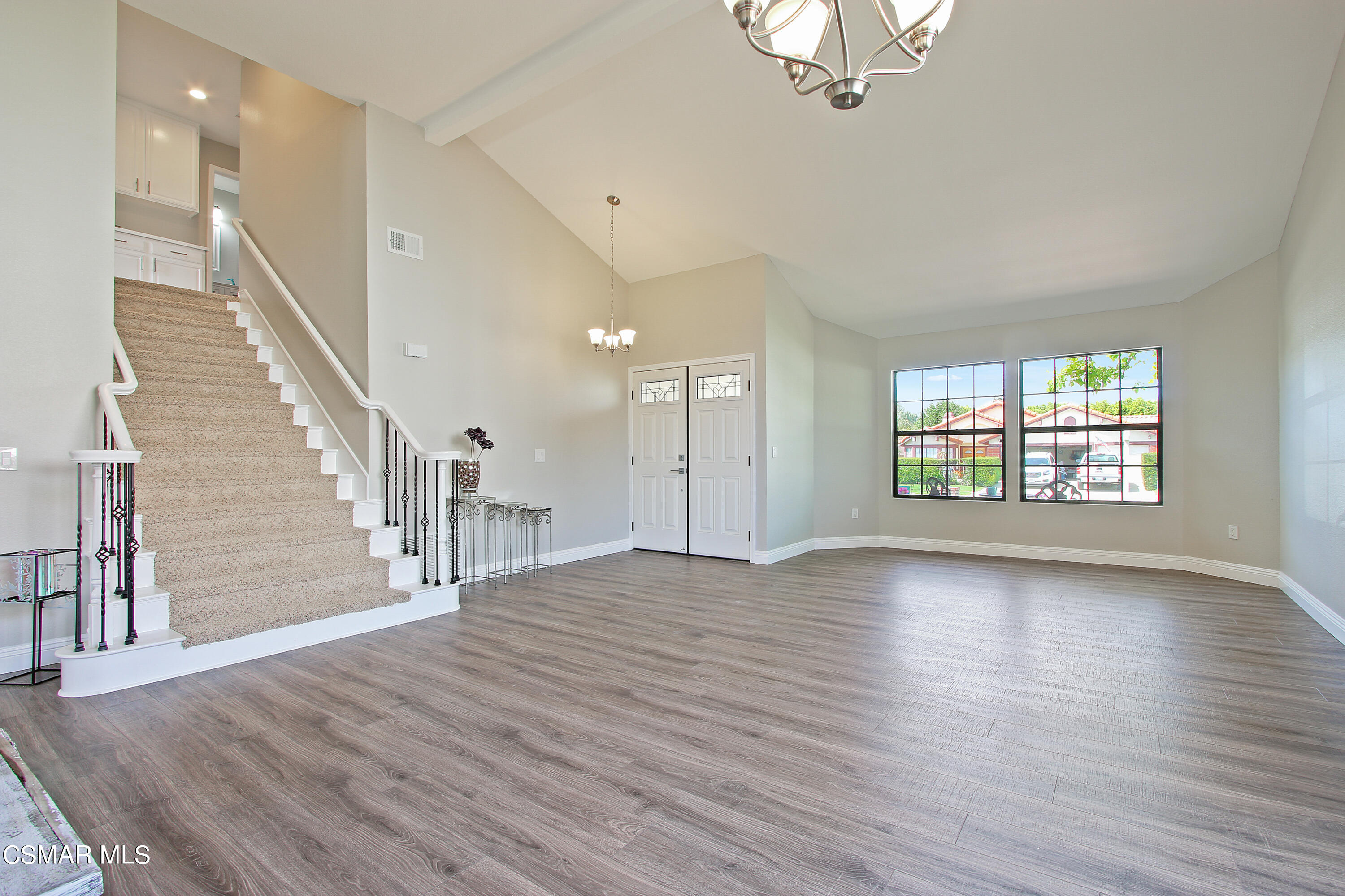 2624 Lemon Drive Simi Valley, CA 93063 - Photo 3 of 22 an empty room with wooden floor chandelier and windows