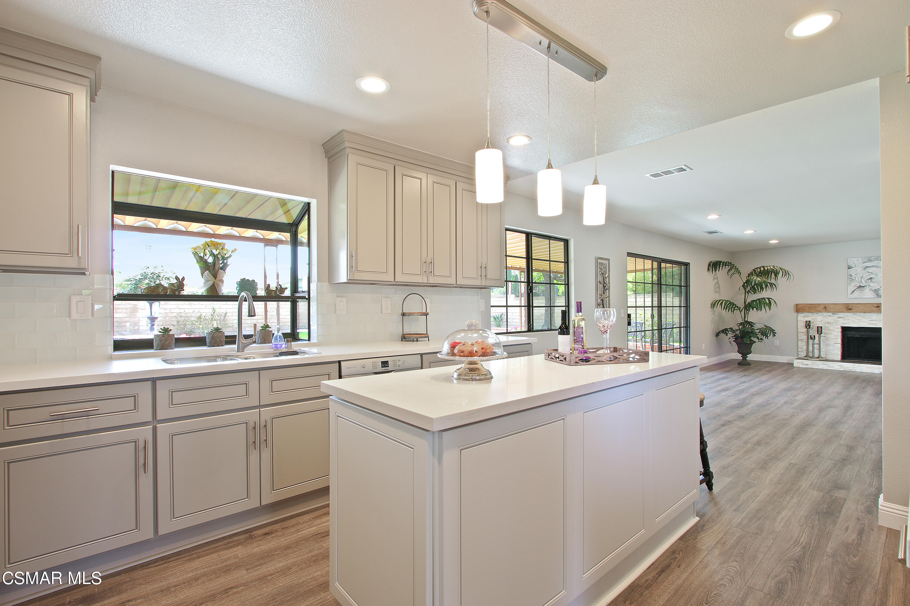 2624 Lemon Drive Simi Valley, CA 93063 - Photo 7 of 22 a kitchen with a sink stove and cabinets