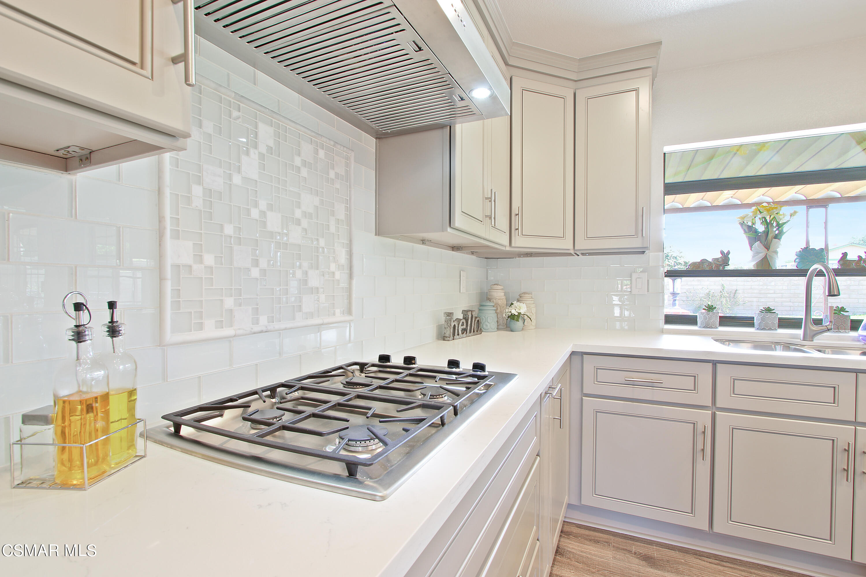 2624 Lemon Drive Simi Valley, CA 93063 - Photo 8 of 22 a kitchen with white cabinets and appliances