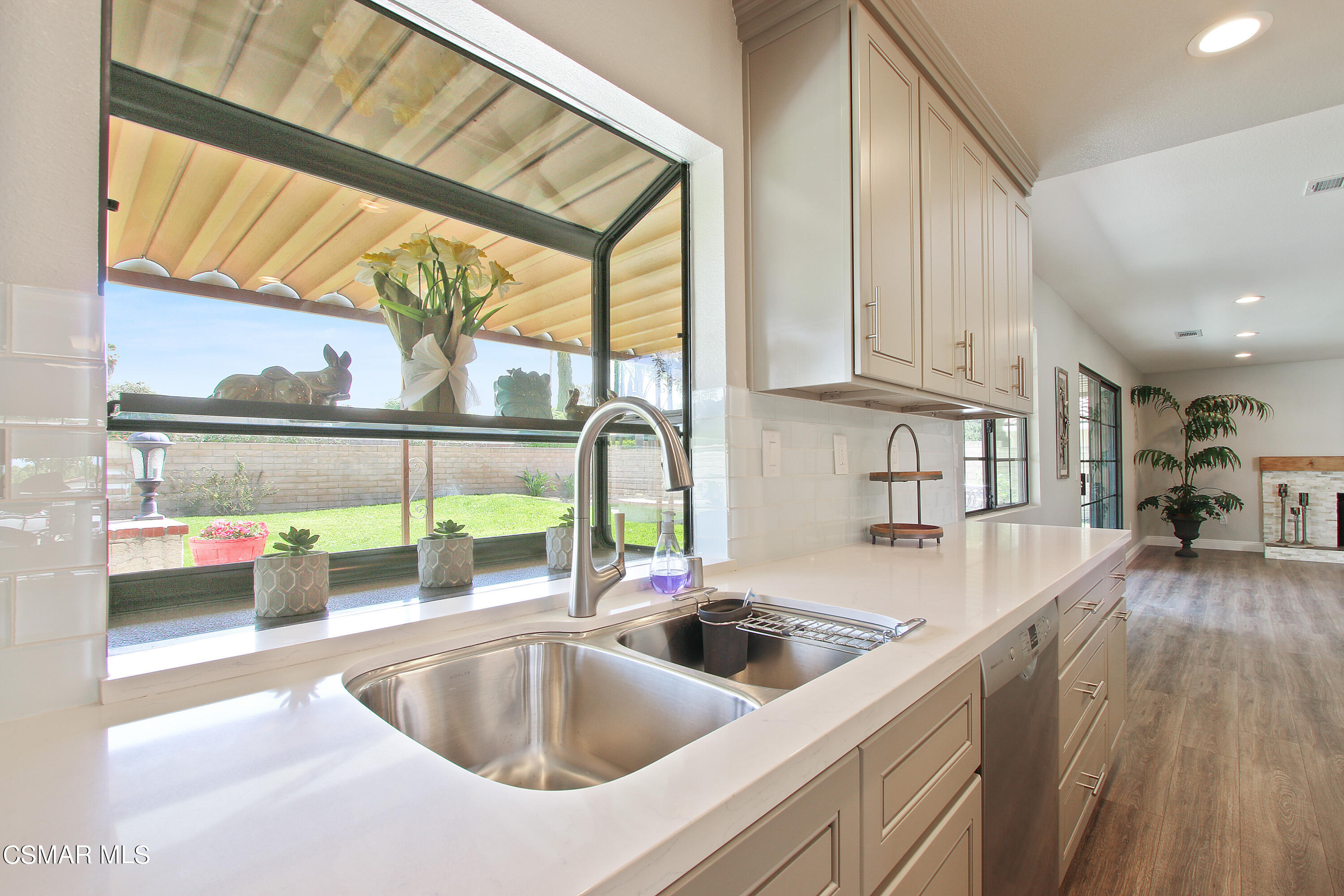 2624 Lemon Drive Simi Valley, CA 93063 - Photo 9 of 22 a kitchen with a sink and a refrigerator