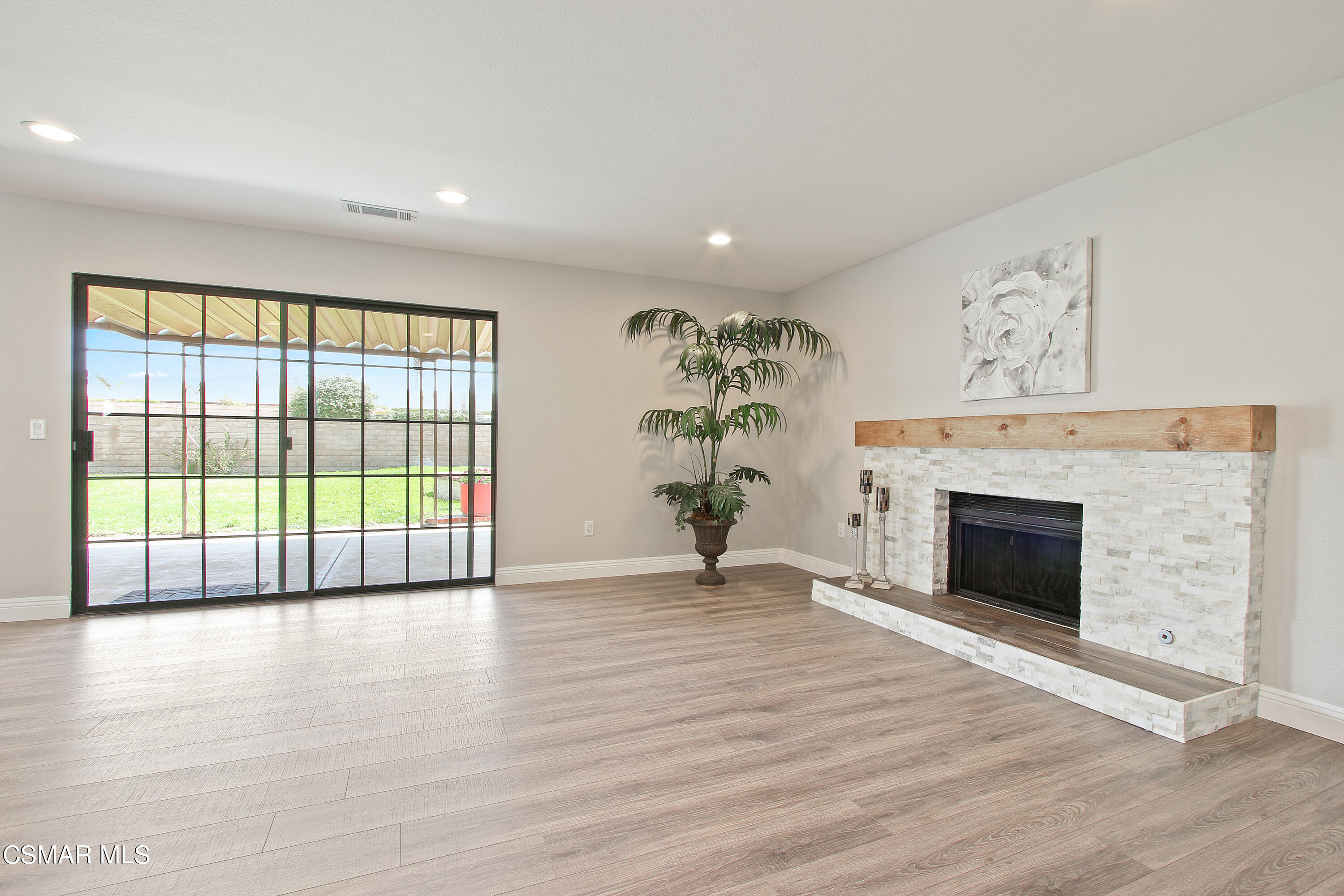 2624 Lemon Drive Simi Valley, CA 93063 - Photo 10 of 22 wooden floor fireplace and windows in an empty room