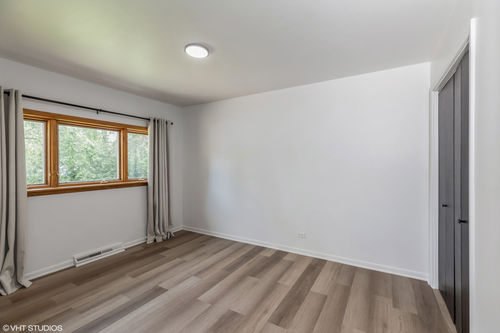 900 Coach Road Homewood, IL 60430 - Photo 13 of 16 wooden floor in an empty room with a window