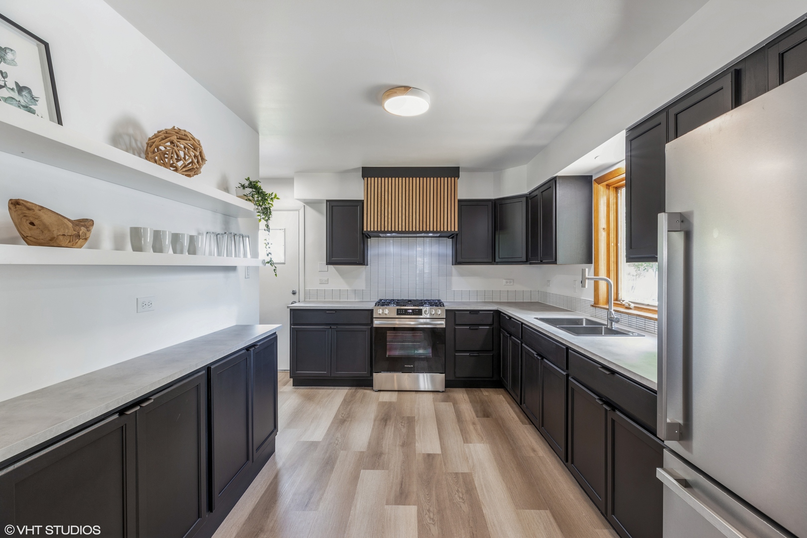 900 Coach Road Homewood, IL 60430 - Photo 5 of 16 a kitchen with stainless steel appliances granite countertop sink stove top oven and cabinets