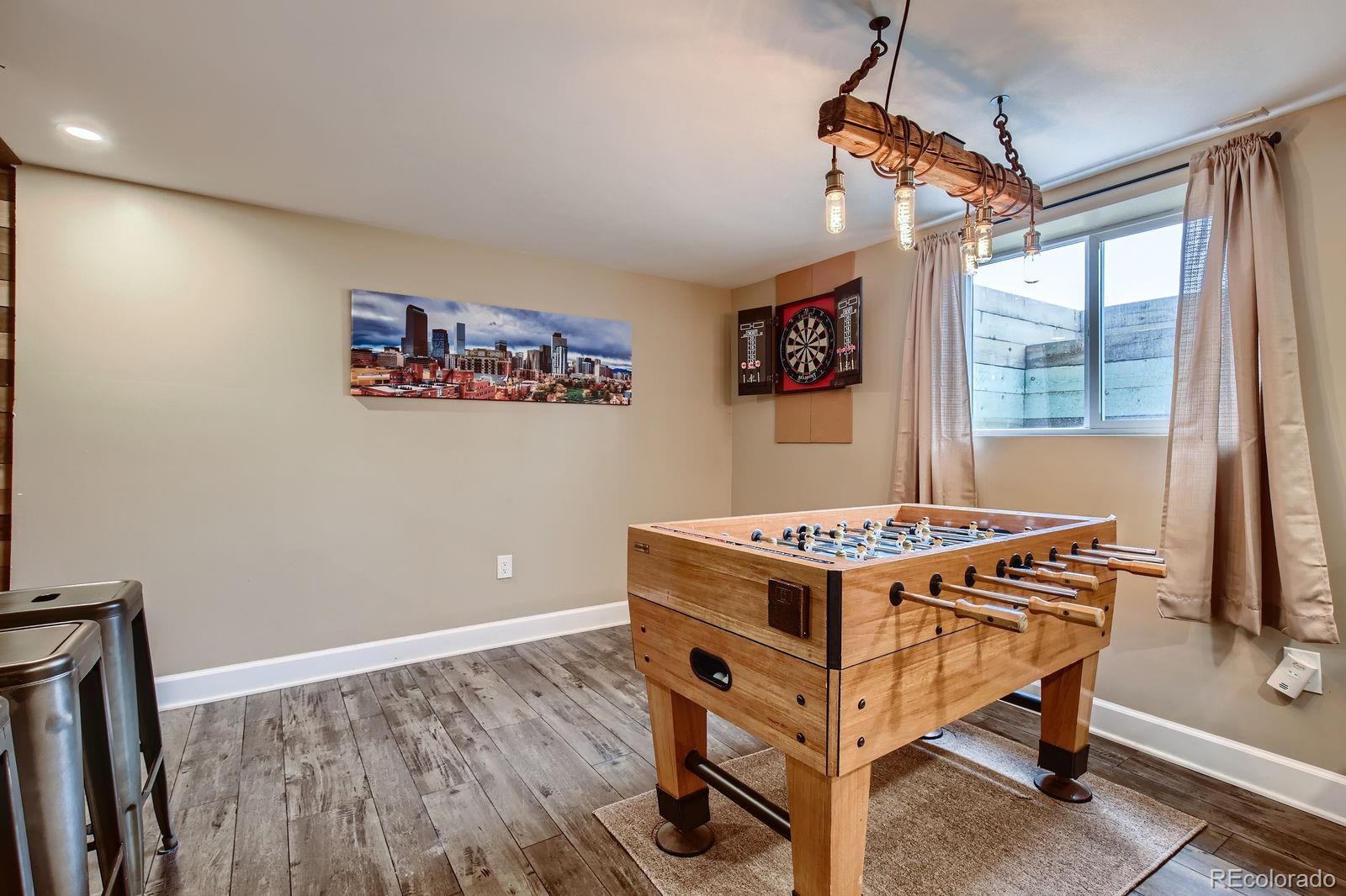 6614 Gray Street Arvada, CO 80003 - Photo 14 of 19 a room with furniture and window