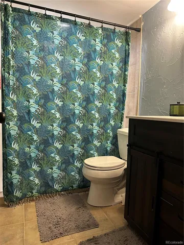 a backyard of a house with a table and chairs