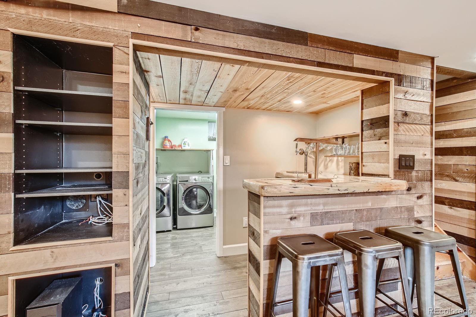 6614 Gray Street Arvada, CO 80003 - Photo 8 of 19 a view of a chair and table in a kitchen