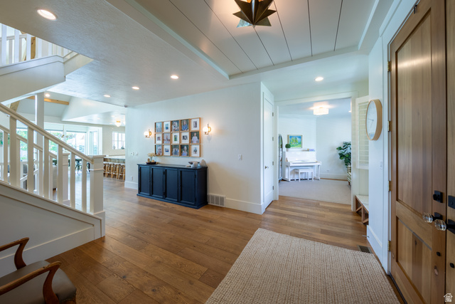 630 East Center Street Alpine, UT 84004 - Photo 15 of 115 Inviting entryway featuring wood-finish flooring, a white spindle staircase, recessed lighting, and a shiplap ceiling
