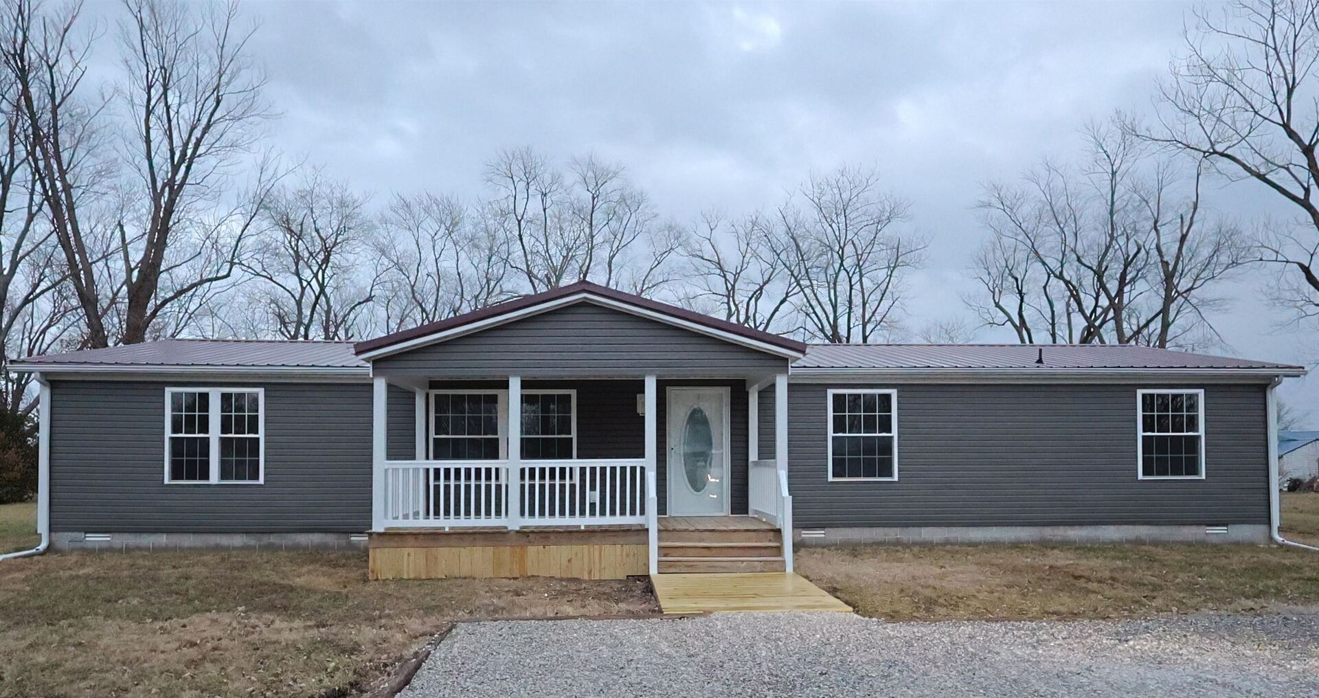 a house with trees in the background
