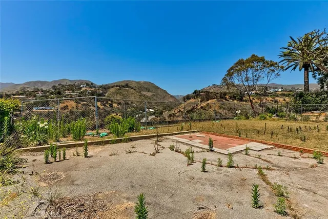 a view of a large body of water with a building in the background