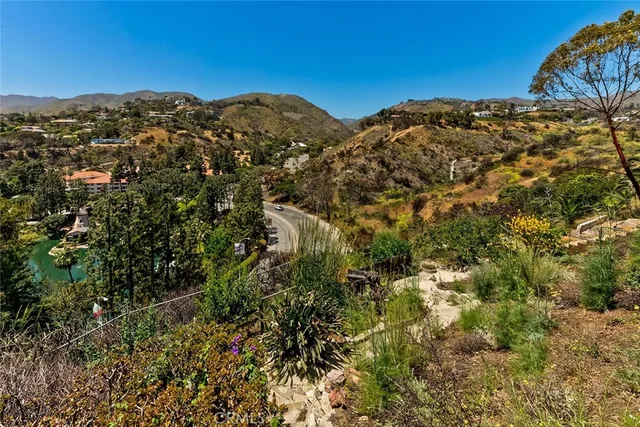 a view of buildings and ocean