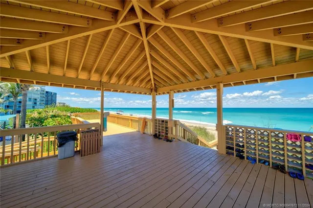 a view of a balcony with wooden floor