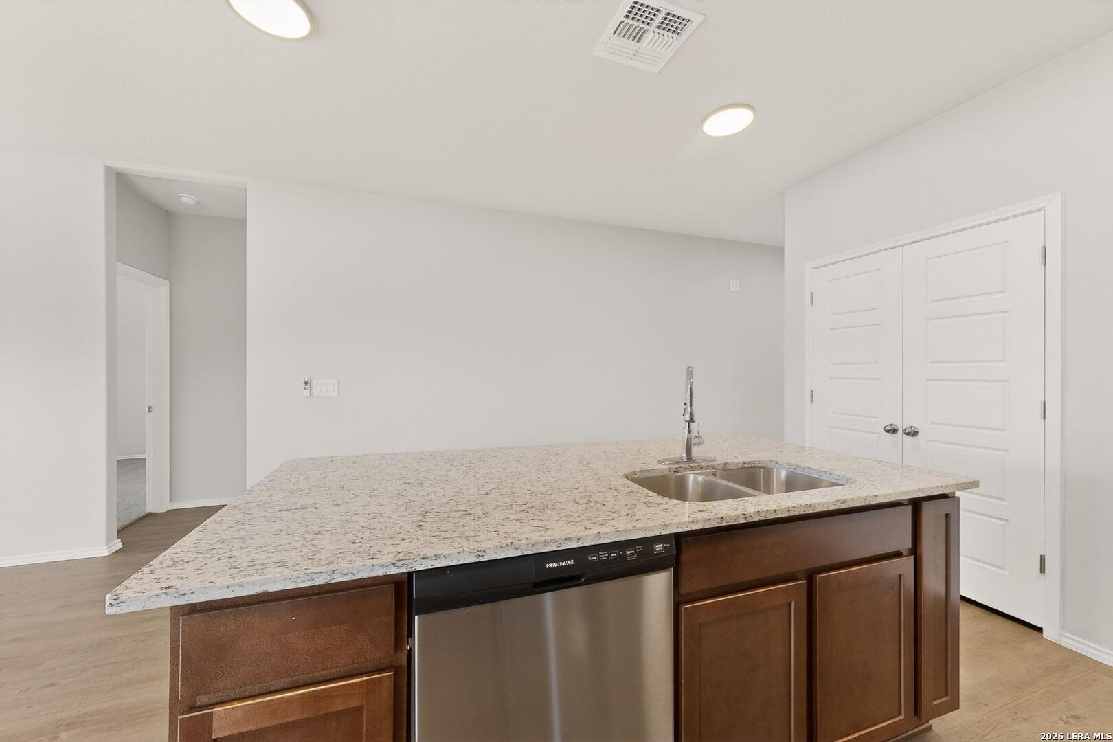 3038 Laguna Cliffs Converse, TX 78109 - Photo 13 of 32 a bathroom with a granite countertop sink and a mirror