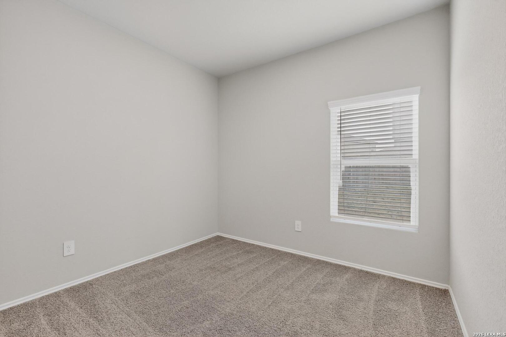 3038 Laguna Cliffs Converse, TX 78109 - Photo 24 of 32 an empty room with a window