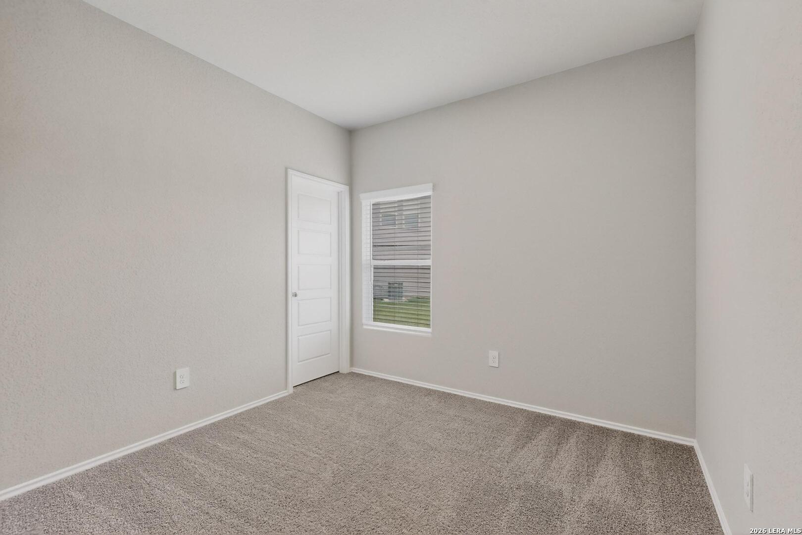 3038 Laguna Cliffs Converse, TX 78109 - Photo 26 of 32 a view of an empty room with a window