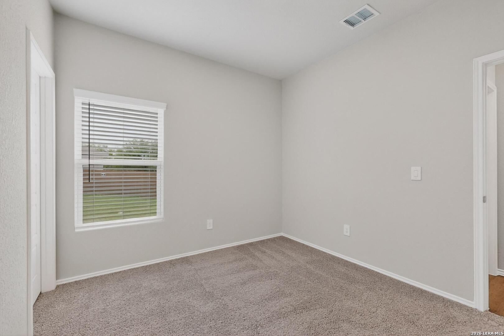 3038 Laguna Cliffs Converse, TX 78109 - Photo 27 of 32 an empty room with a window