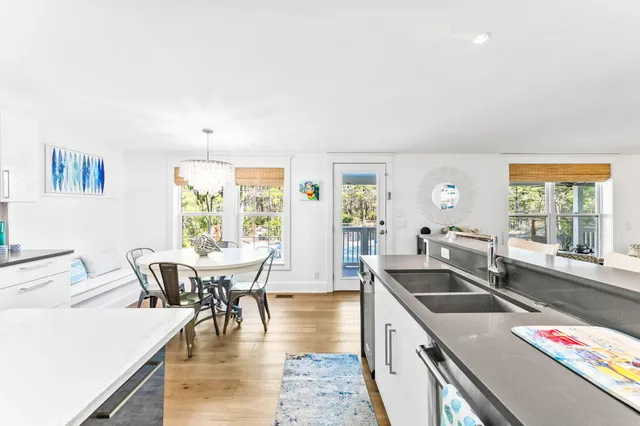 a kitchen that has a table and chairs in it