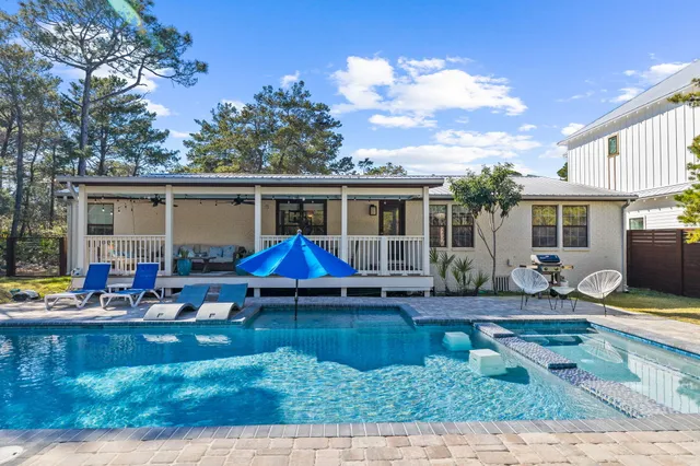 a view of pool with outdoor seating