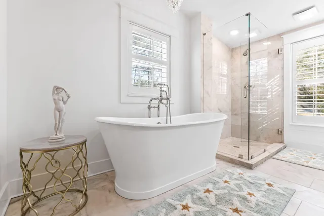 a white bath tub sitting in a bathroom