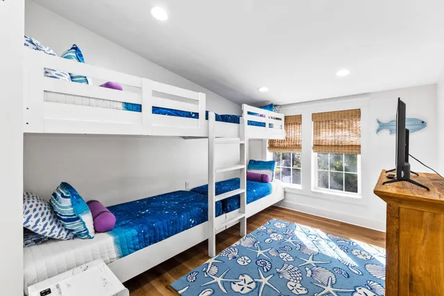 a living room with lots of furniture and a rug