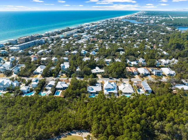 a view of a house with backyard sitting area and garden