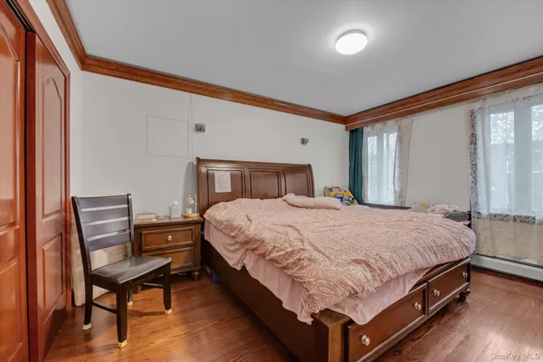 a bedroom with a bed and chair
