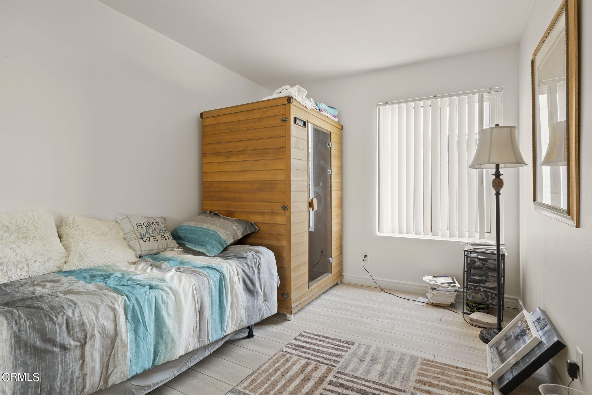 3551-3553 Sunset Lane Oxnard, CA 93035 - Photo 15 of 37 a bedroom with a bed and a window