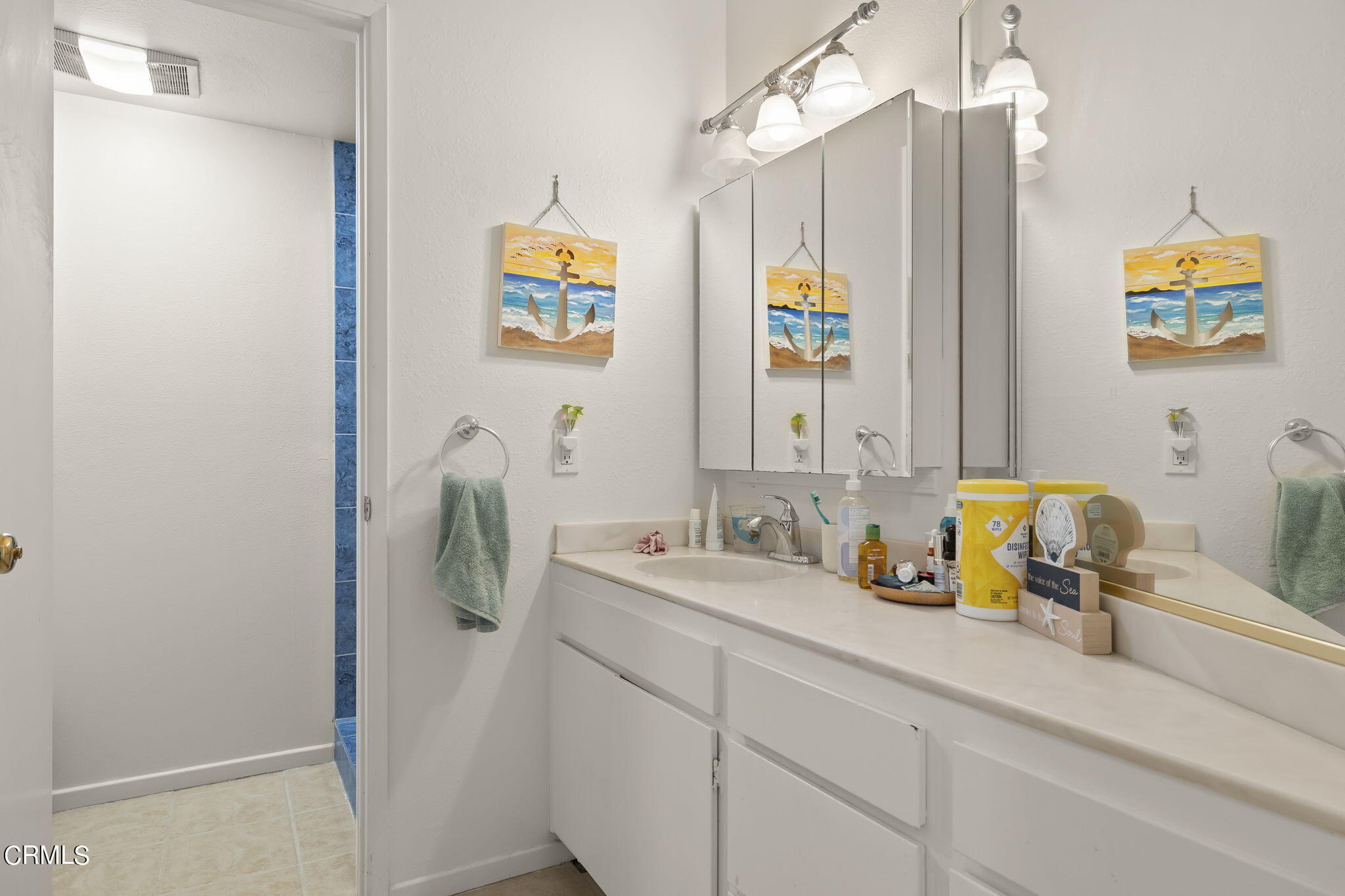 3551-3553 Sunset Lane Oxnard, CA 93035 - Photo 17 of 37 a bathroom with a sink and a mirror