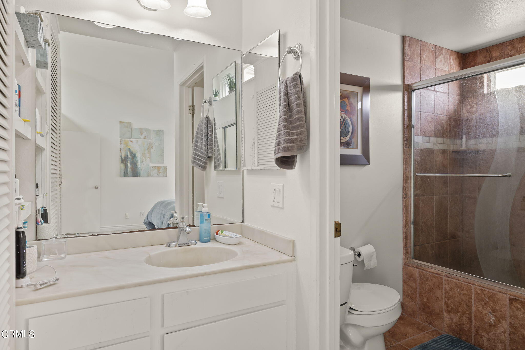3551-3553 Sunset Lane Oxnard, CA 93035 - Photo 20 of 37 a bathroom with a sink toilet and shower