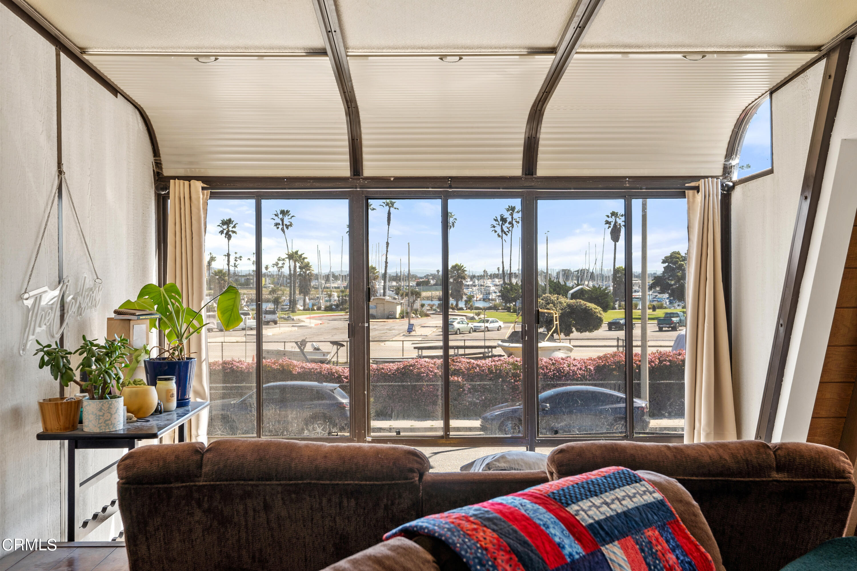 3551-3553 Sunset Lane Oxnard, CA 93035 - Photo 22 of 37 a living room with furniture and a floor to ceiling window