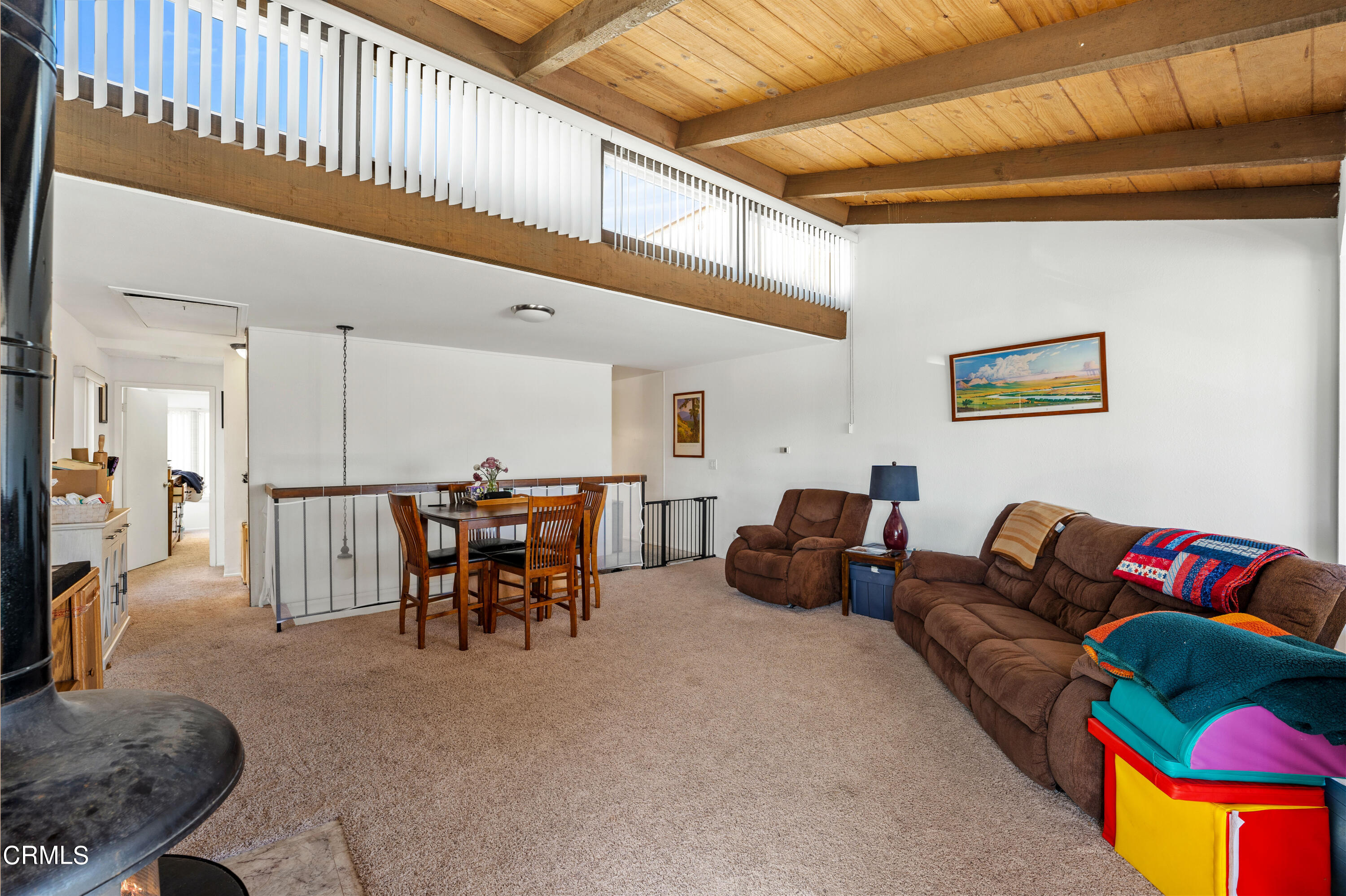 3551-3553 Sunset Lane Oxnard, CA 93035 - Photo 24 of 37 a living room with furniture and a large window