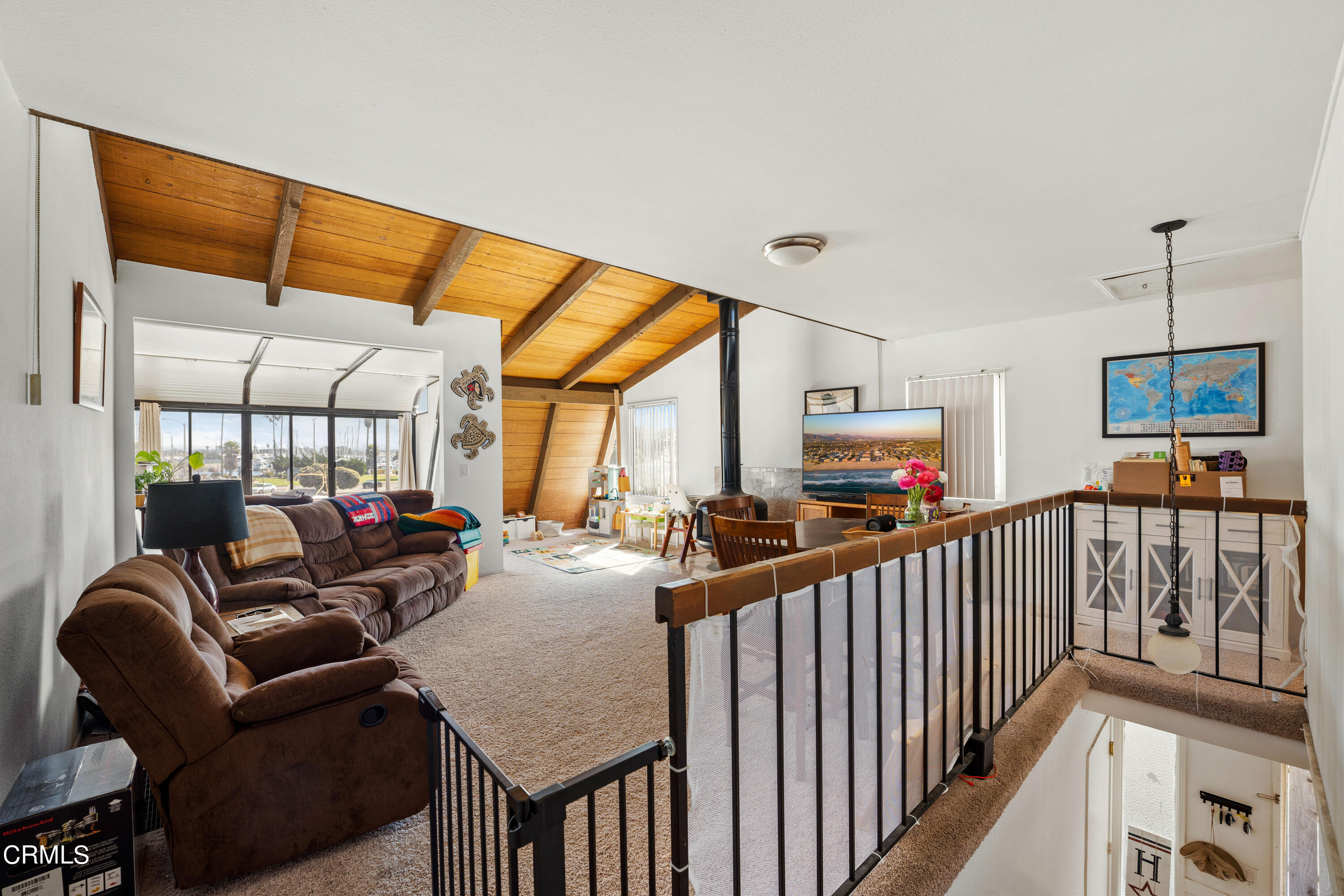 3551-3553 Sunset Lane Oxnard, CA 93035 - Photo 25 of 37 a view of a livingroom with furniture wooden floor and windows
