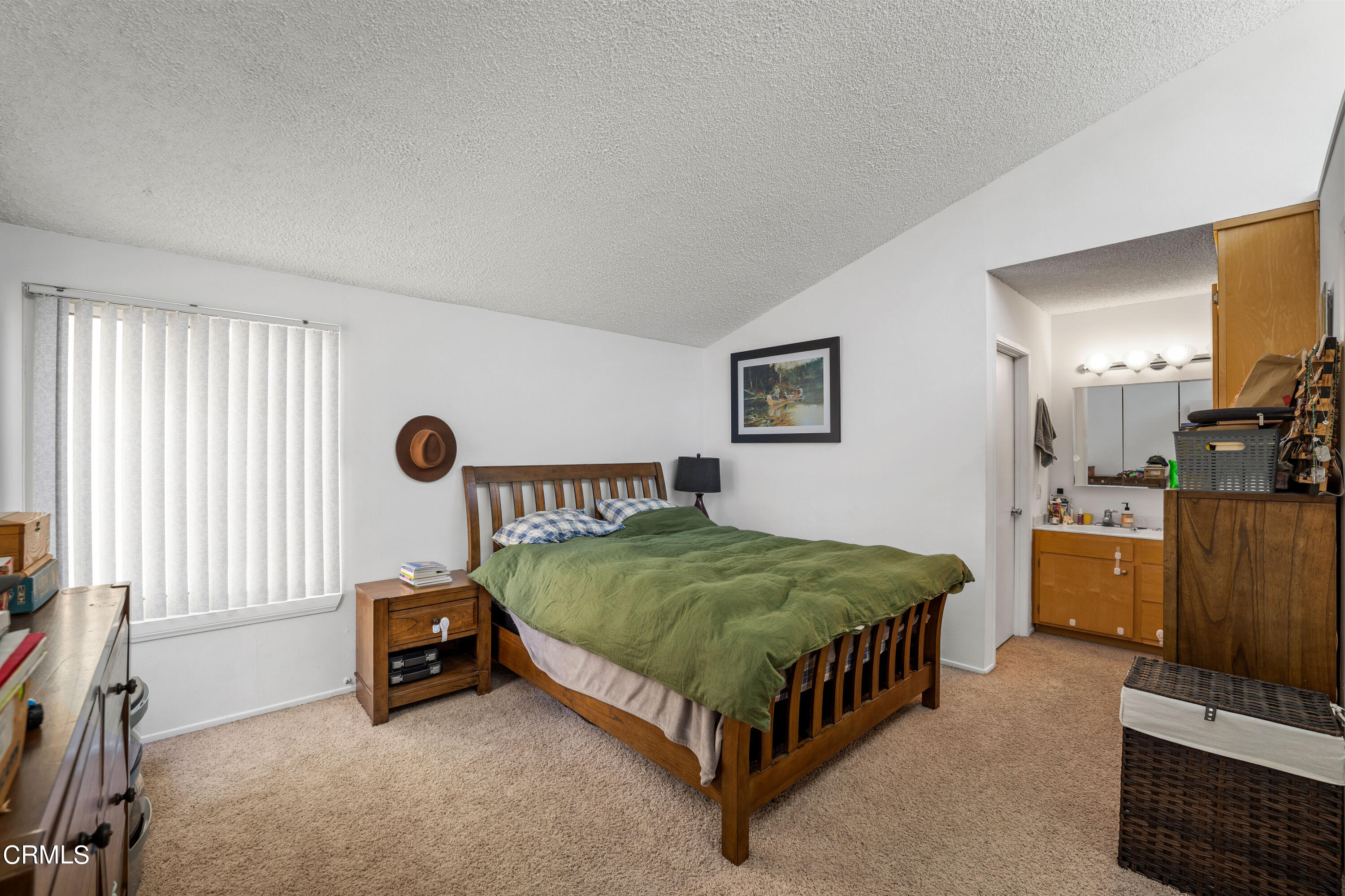 3551-3553 Sunset Lane Oxnard, CA 93035 - Photo 28 of 37 a bedroom with a bed and a flat tv screen on dresser