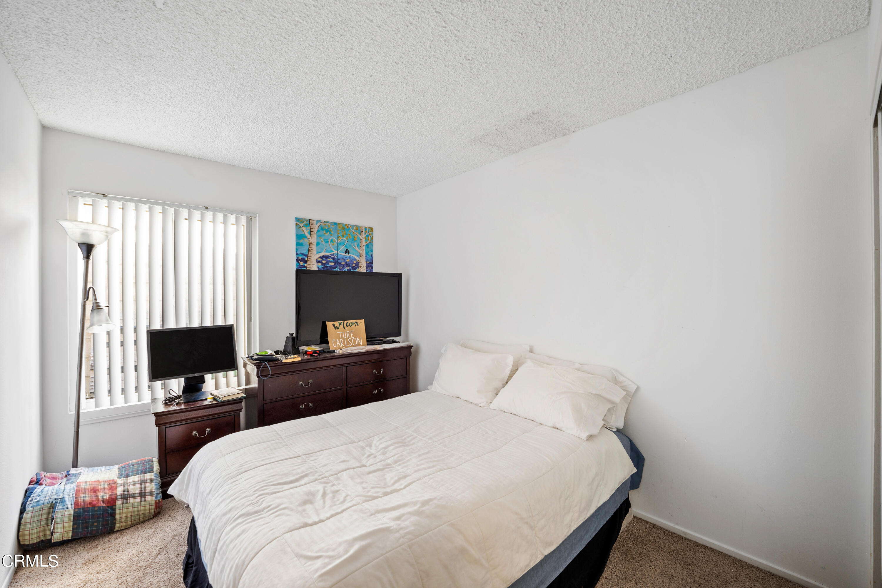 3551-3553 Sunset Lane Oxnard, CA 93035 - Photo 30 of 37 a bedroom with a bed and a tv