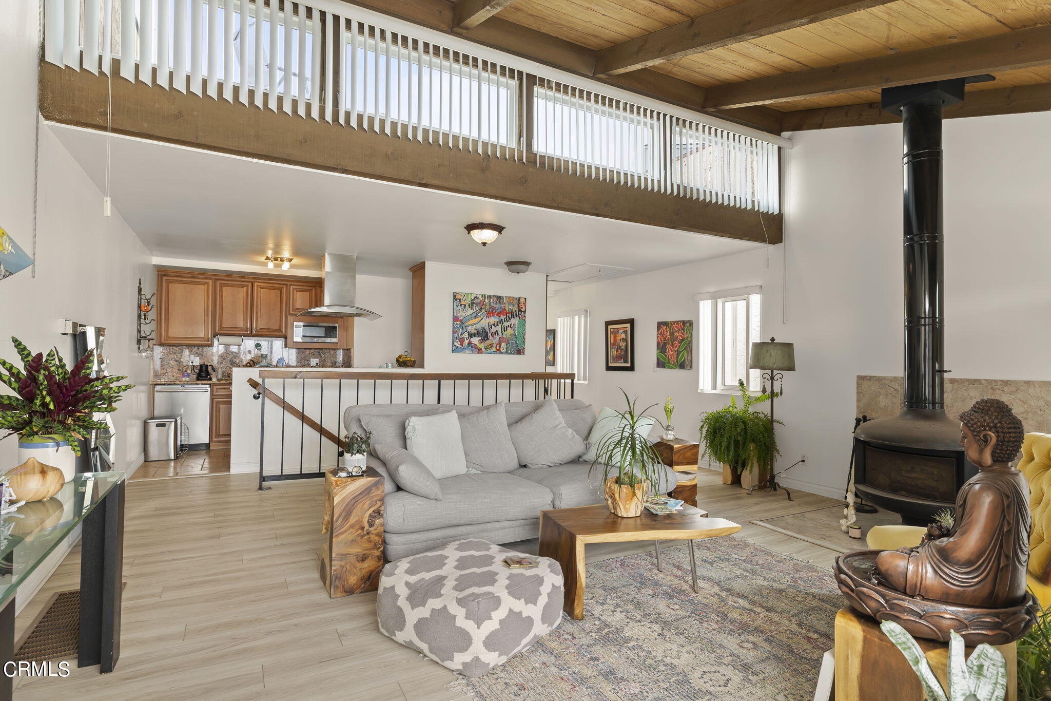 3551-3553 Sunset Lane Oxnard, CA 93035 - Photo 6 of 37 a living room with furniture stairs and a potted plant