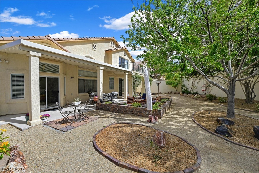 1259 Moon Vision Street Henderson, NV 89052 - Photo 37 of 53 A private yard with multiple patios and lush landscaping awaits your outdoor enjoyment.