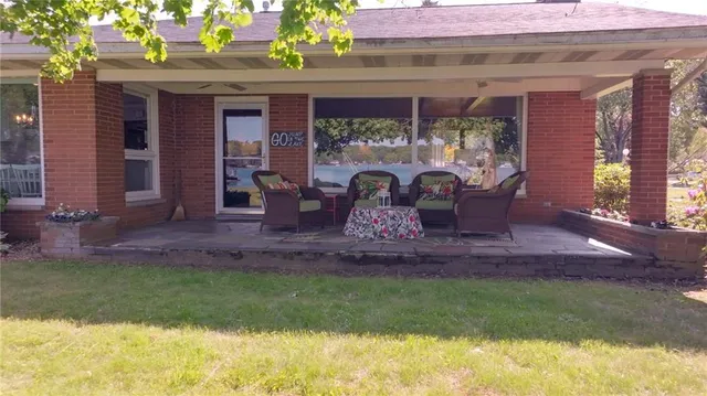 a front view of house with outdoor seating