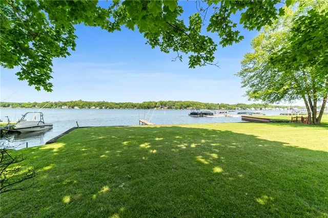 a view of a lake with houses in the back